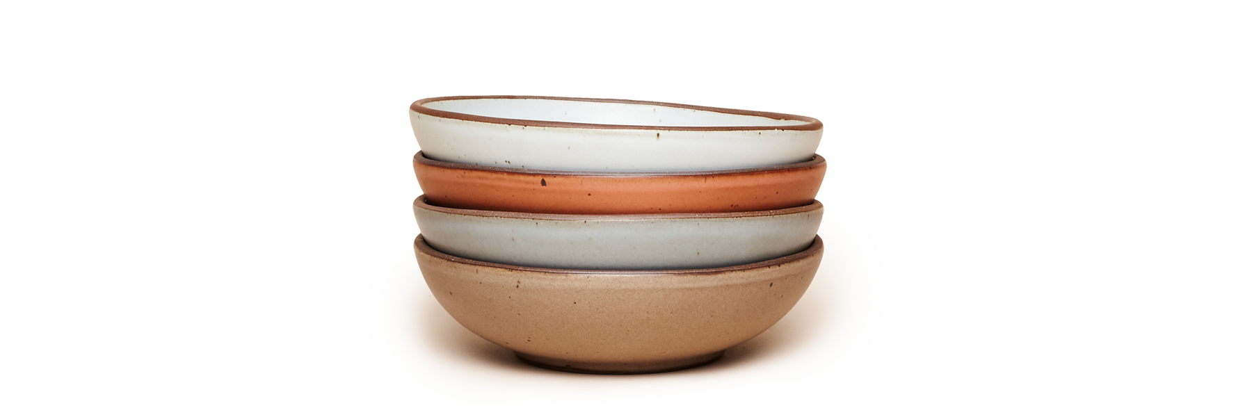 A stack of East Fork Everyday Bowls in a variety of colors