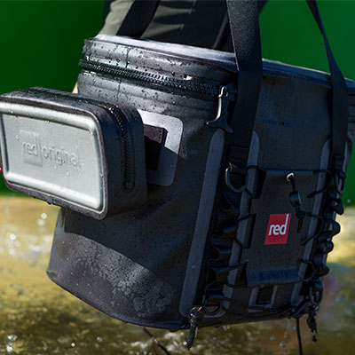 Man Carrying Cool bag out of water