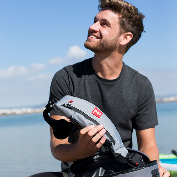 Man packs holds Air Belt PFD