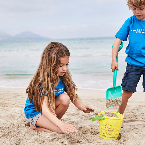 Kids playing in the sand on the beach