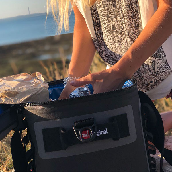 Female getting items from cool bag.