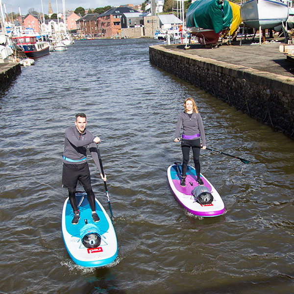 Male and Female wearing performance top layer.