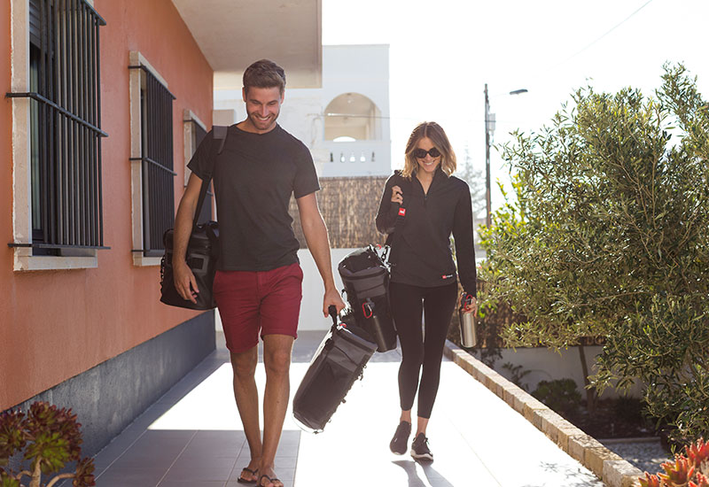 Woman carry a deck bag using the Red Original carry strap