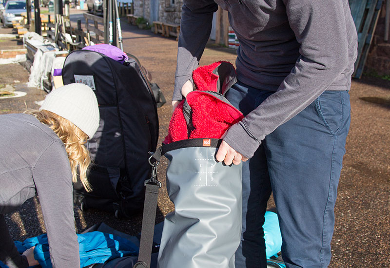 Packing a Red Original Roll Top Dry Bag