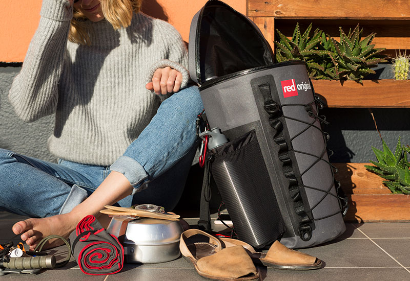 Woman packing the Red Original deck bag
