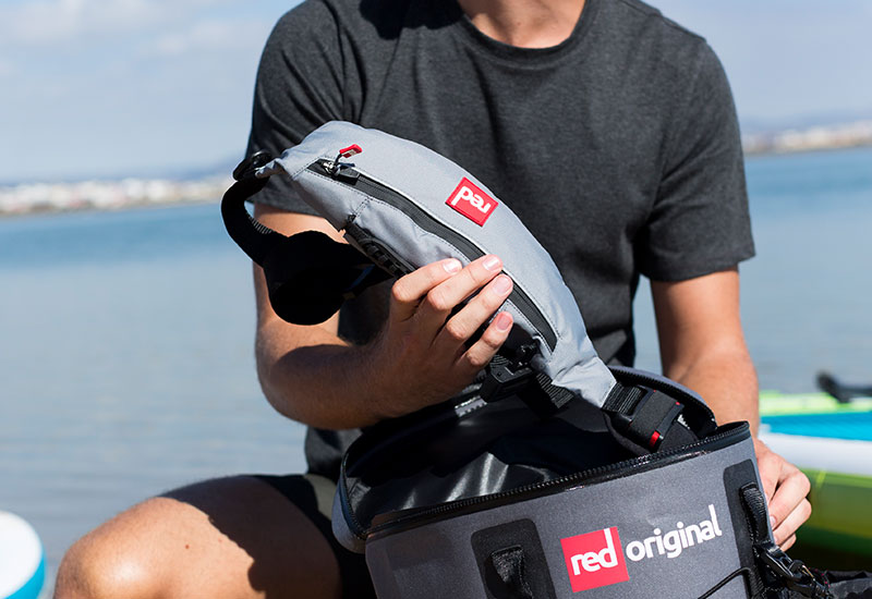 Red Original Airbelt PFD being taken out of a deck bag