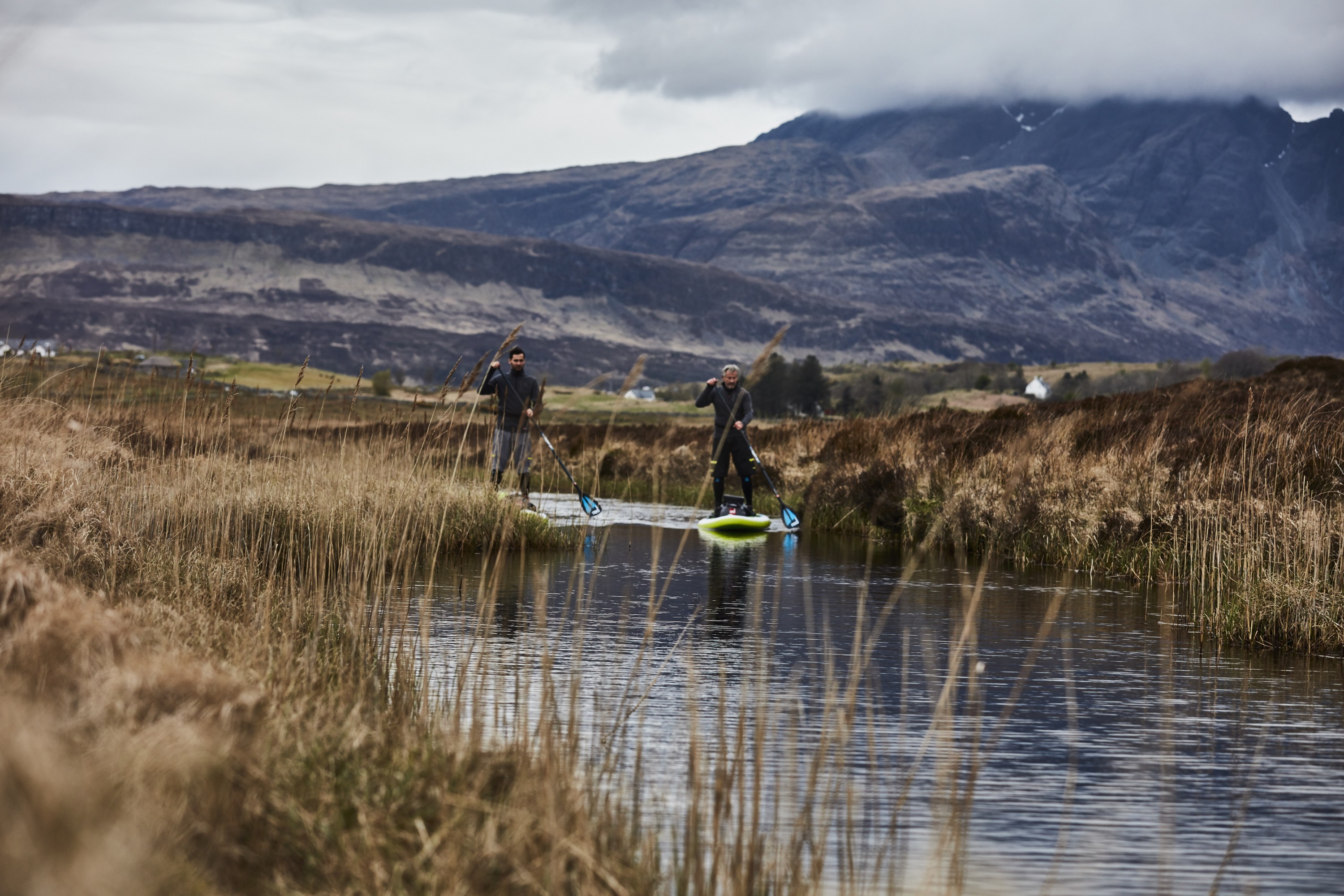 Men Paddling through Scotland in cold weather