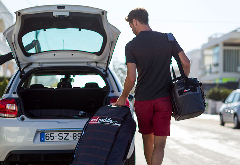 Carrying the Red Original cool bag to the car
