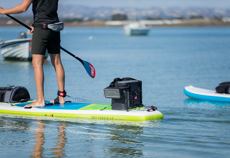 Paddling with the Red Original Dry Pouch attached to a cool bag
