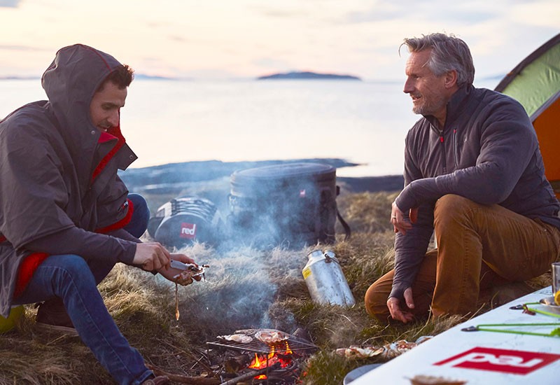 Technical top layer and waterproof jacket being worn outdoors