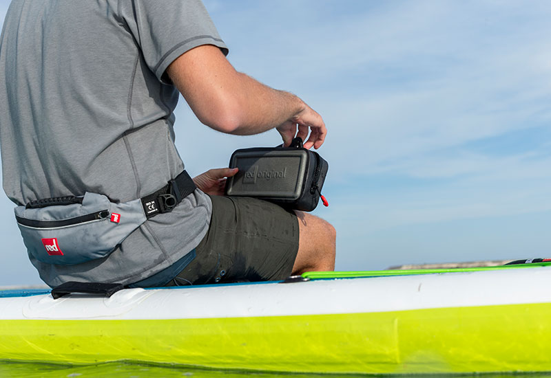Accessing contents of Red Original Dry Pouch on the water