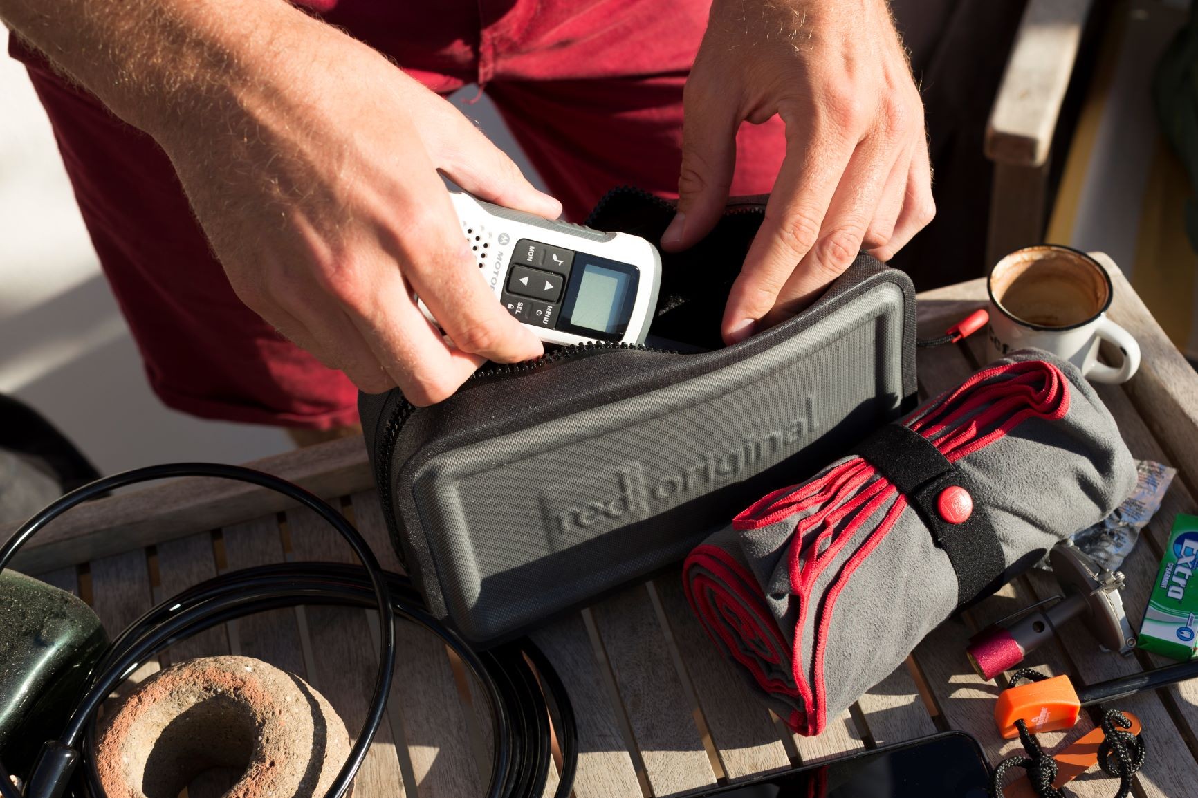 Preparing for day on the water with Red Original Dry Pouch, microfibre towel and Board lock